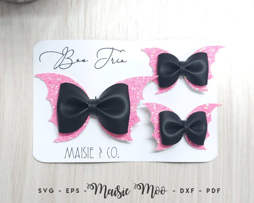 The Bat Pinch Bow – A Halloween Favorite displayed in a two-piece pigtail set and a regular sized bow.