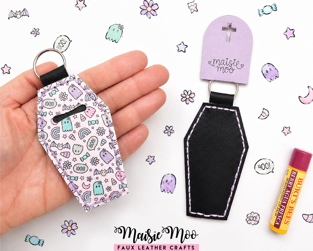 Coffin Lip Balm Holder showcased in hand with Halloween-themed patterns and pink chapstick on a colorful background.