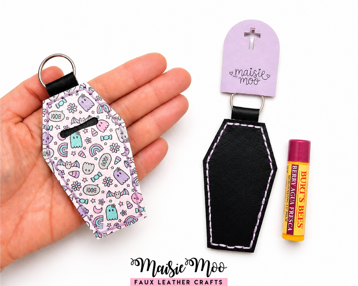 Coffin Lip Balm Holder displayed in hand, featuring Halloween design, perfect for lip balm and chapstick style tubes.