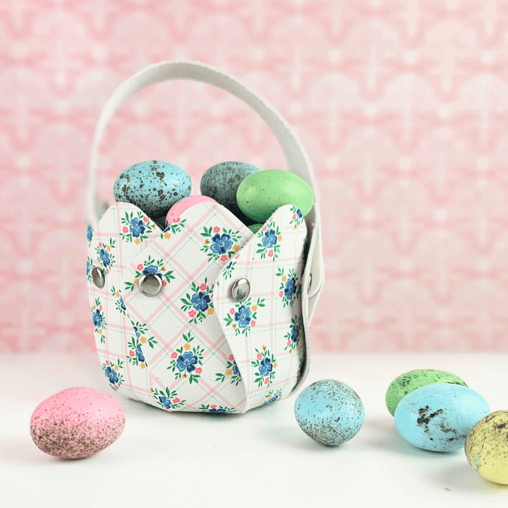 Blossom Basket a FREE SVG by Maisie Moo Design filled with colorful faux eggs on a pink background.