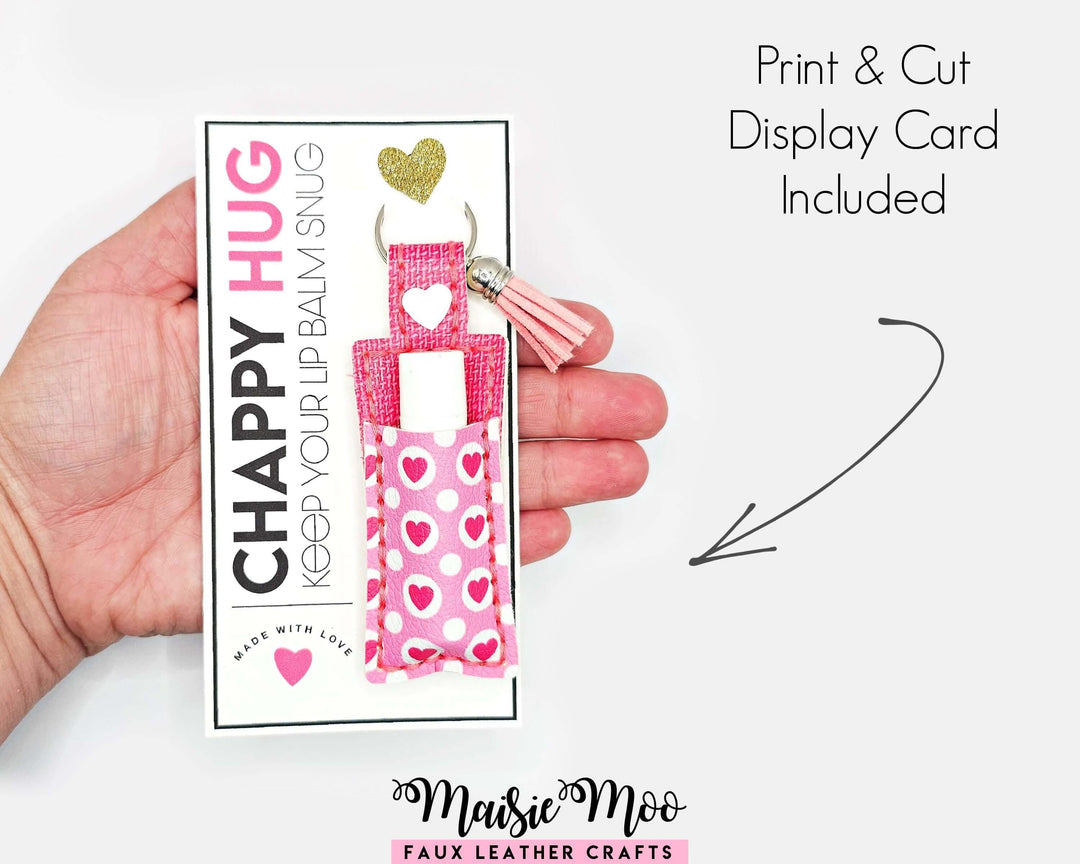 ChapStick Holder Keychain displayed on a hand with a print & cut display card, featuring a pink heart pattern.
