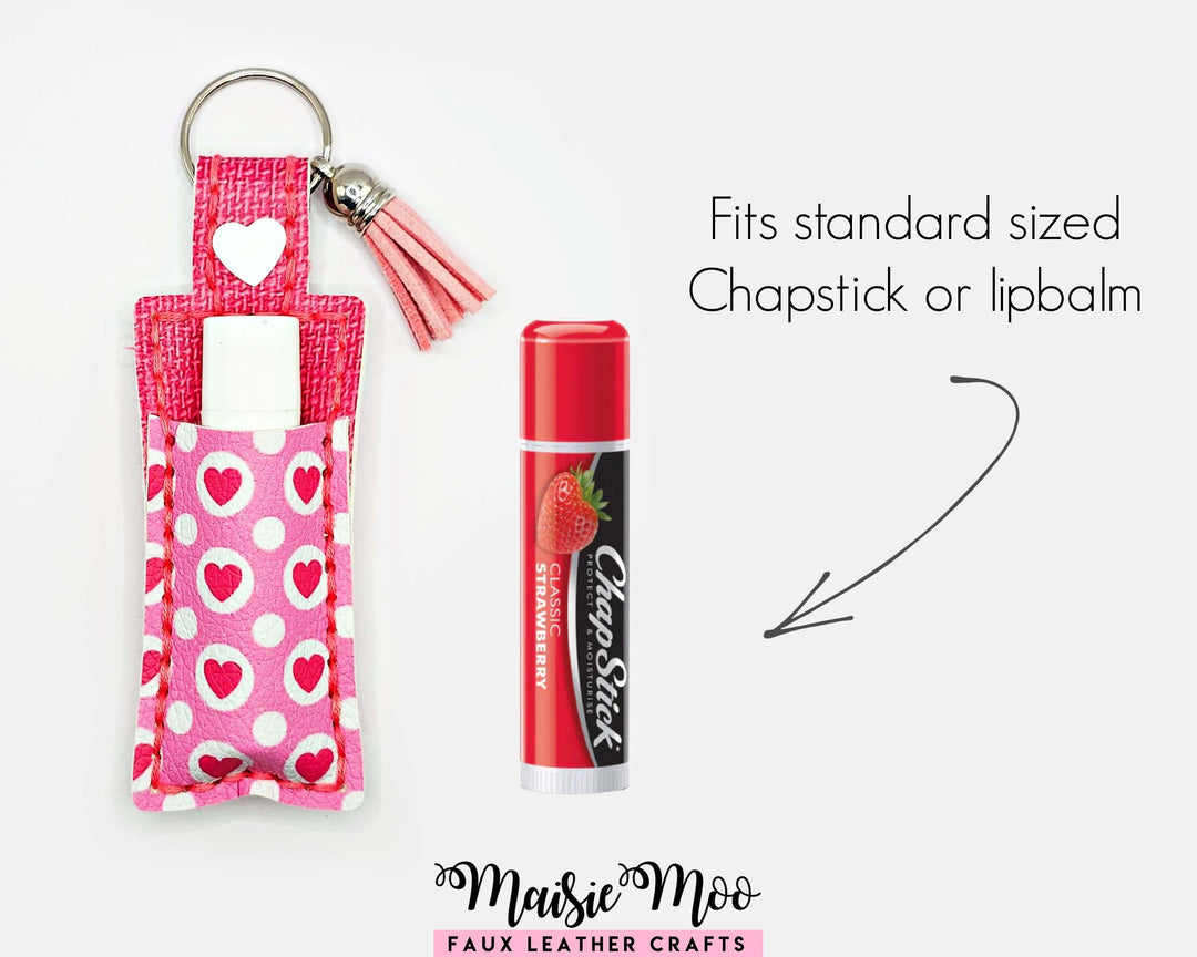 ChapStick Holder Keychain in pink hearts pattern with a ChapStick, ideal for gifts and personal use.
