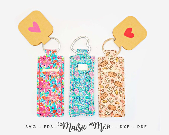 Colorful Chapstick holder keychains featuring floral and pumpkin designs, showcasing the Chapstick Holder Pattern by Maisie Moo.