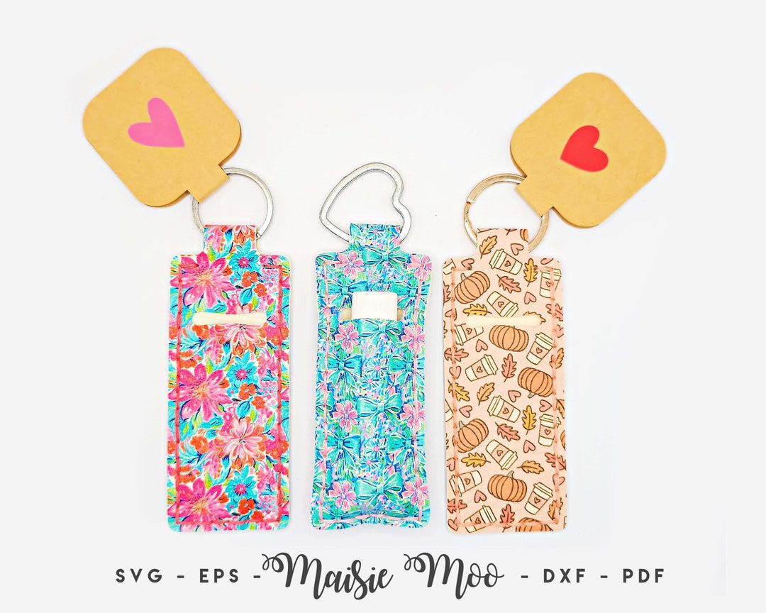 Colorful Chapstick holder keychains featuring floral and pumpkin designs, showcasing the Chapstick Holder Pattern by Maisie Moo.