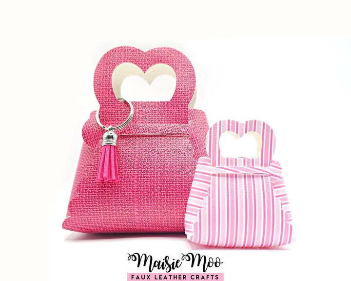 Folded Heart Purse - Gift Bag in pink with heart-shaped handles, showcasing scalloped edges and stylish design by Maisie Moo.