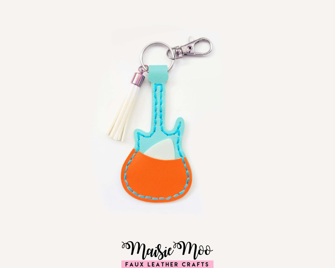 Guitar Shaped Pick Holder keychain in colorful faux leather, designed for holding guitar picks.