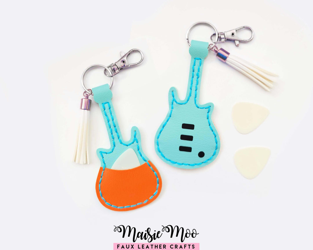 Guitar Shaped Pick Holder keychain featuring colorful faux leather designs and plectrums for easy crafting.
