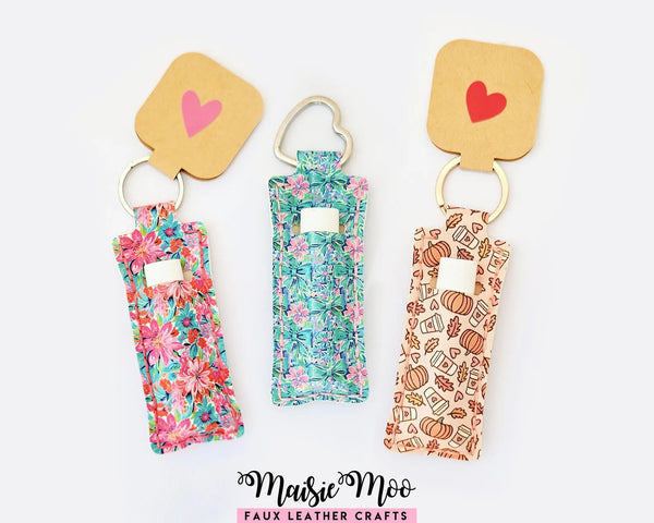 Chapstick Holder Pattern featuring colorful folded chapstick holders with keychains in floral and autumn designs.