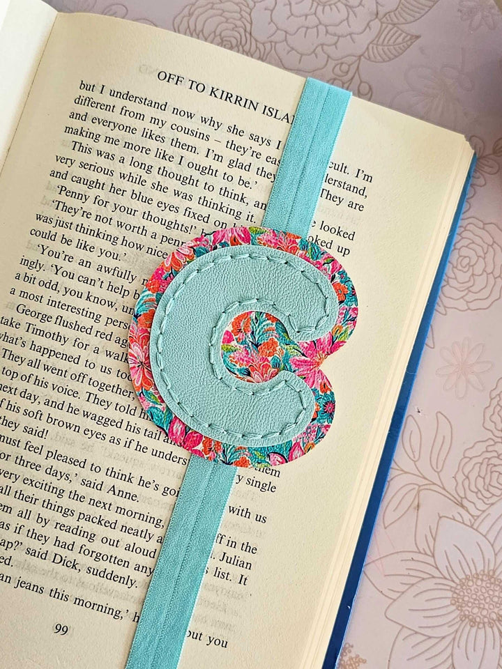 Alphabet Bookmark featuring a floral letter 'C' design on a blue faux leather book band.