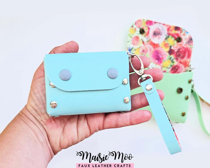 Rivet Leather Purse shown in blue faux leather, demonstrating versatility as a coin purse or mini handbag.